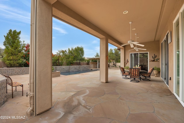 view of patio featuring ceiling fan