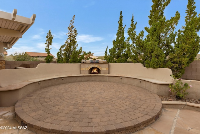 view of patio featuring exterior fireplace