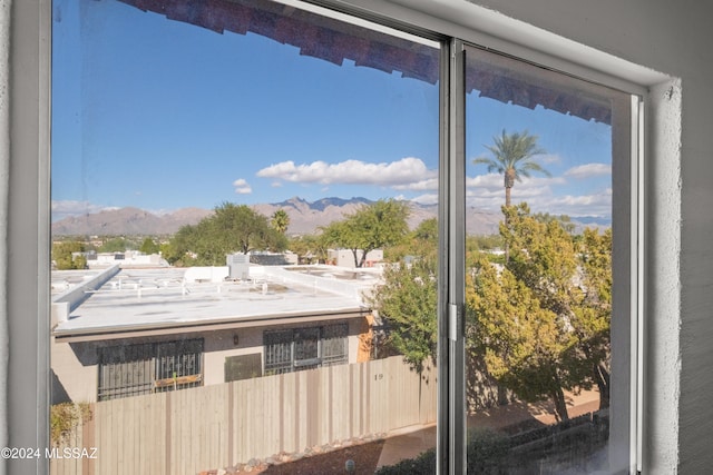 doorway to outside with a mountain view