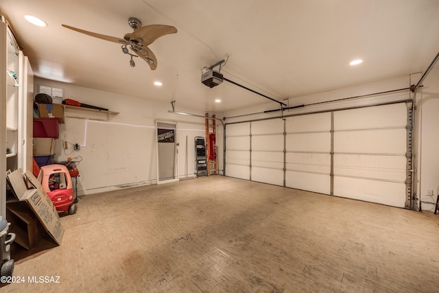 garage with ceiling fan and a garage door opener