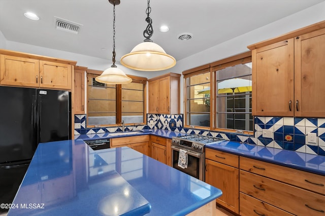 kitchen with black appliances, decorative backsplash, sink, and decorative light fixtures