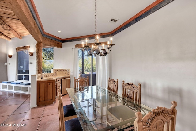 tiled dining space featuring beam ceiling and a notable chandelier