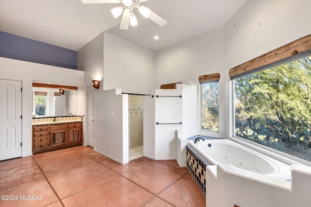 full bath featuring baseboards, tiled shower, a tub with jets, tile patterned floors, and vanity