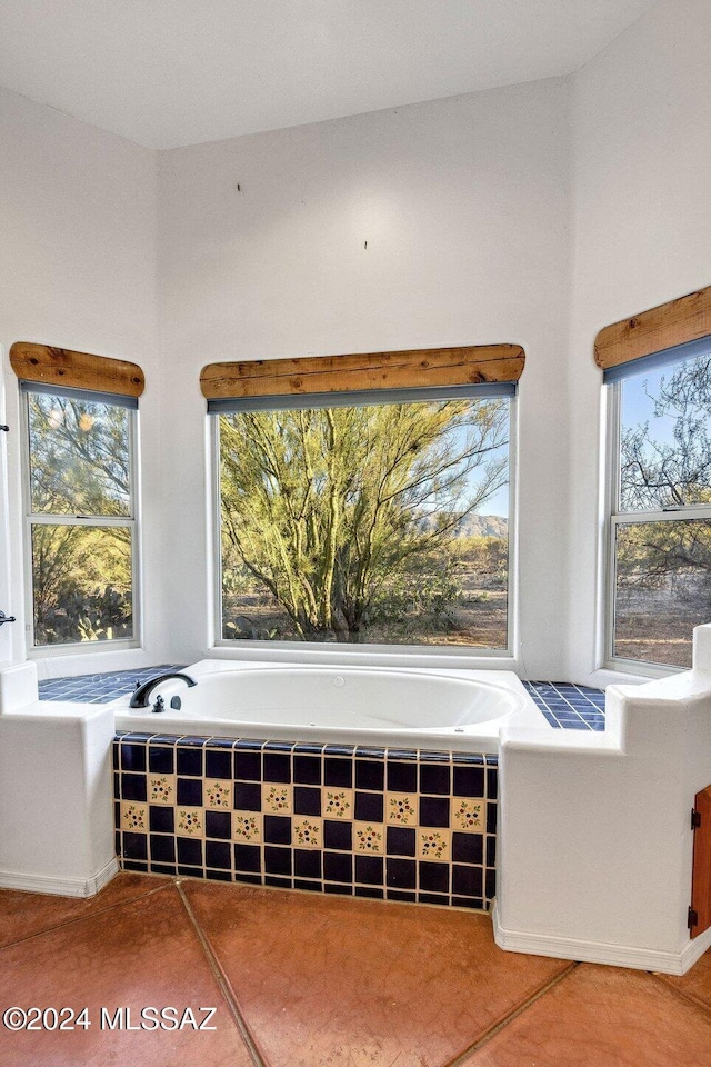 living area featuring tile patterned flooring and a healthy amount of sunlight