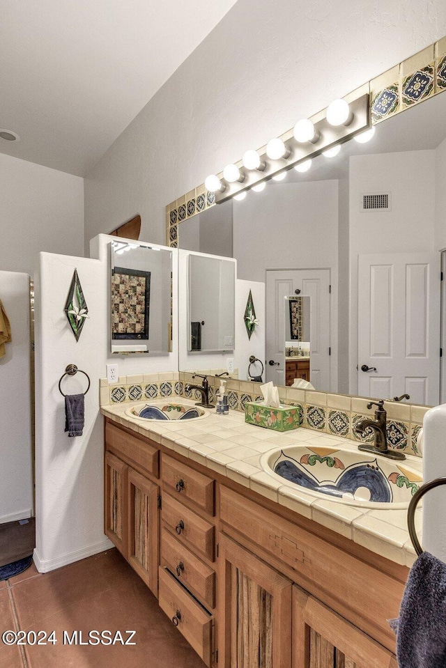 full bathroom with double vanity, a sink, and visible vents