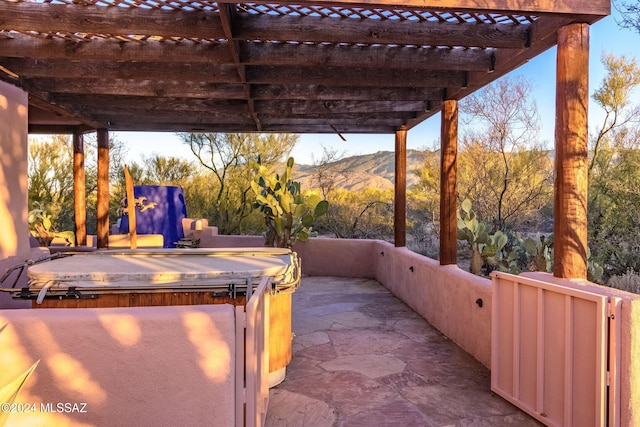 view of patio featuring a mountain view and a pergola