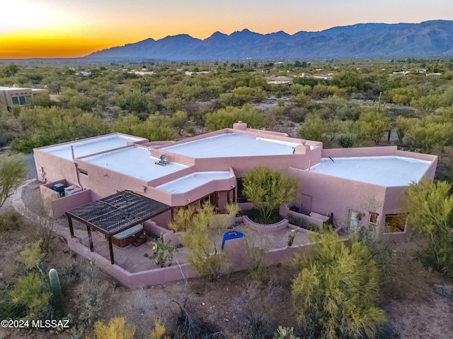 aerial view at dusk with a mountain view