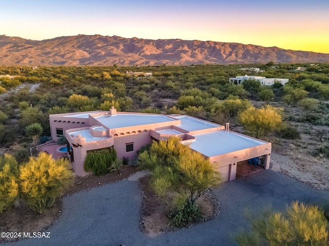 aerial view at dusk with a mountain view