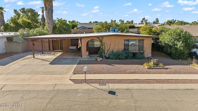 single story home featuring a carport