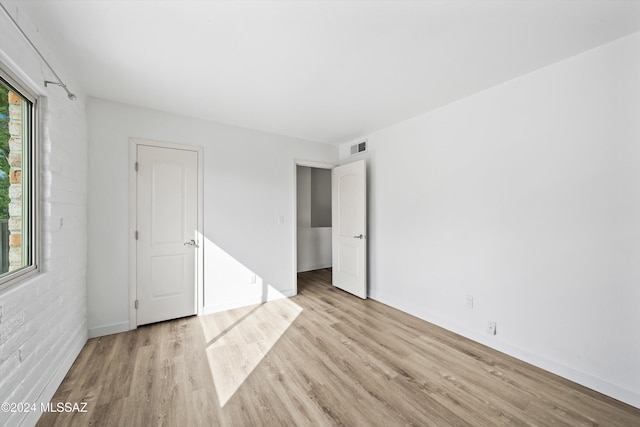 empty room with light wood-type flooring