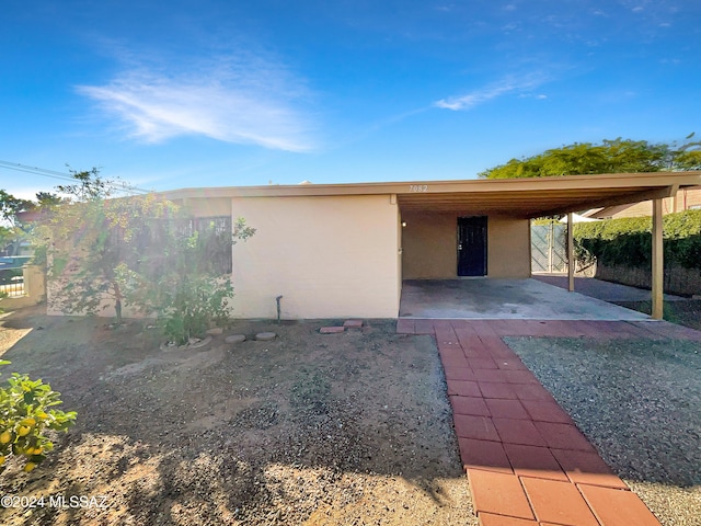 exterior space with a carport