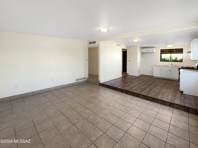 interior space featuring sink and light wood-type flooring