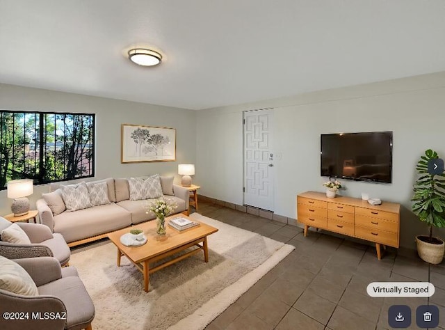 living room featuring dark tile patterned flooring