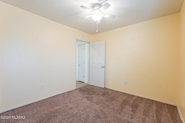 carpeted empty room with ceiling fan