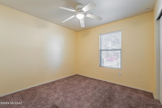 unfurnished room with carpet and ceiling fan