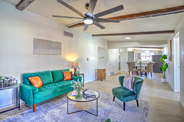 living room with light hardwood / wood-style floors, ceiling fan, and beam ceiling