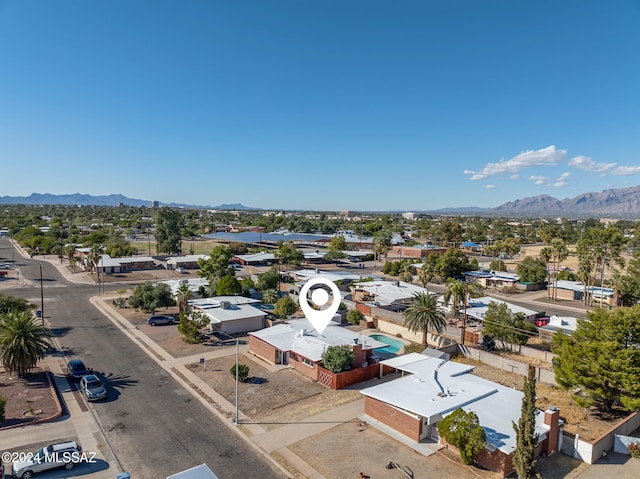 birds eye view of property with a mountain view