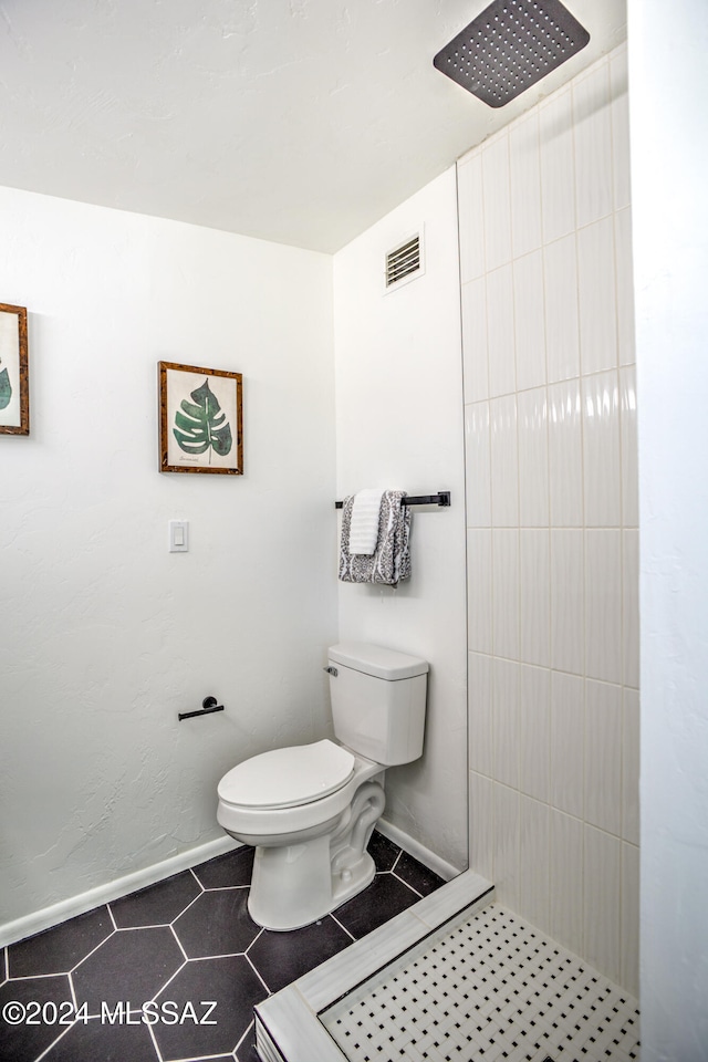 bathroom with a shower and toilet