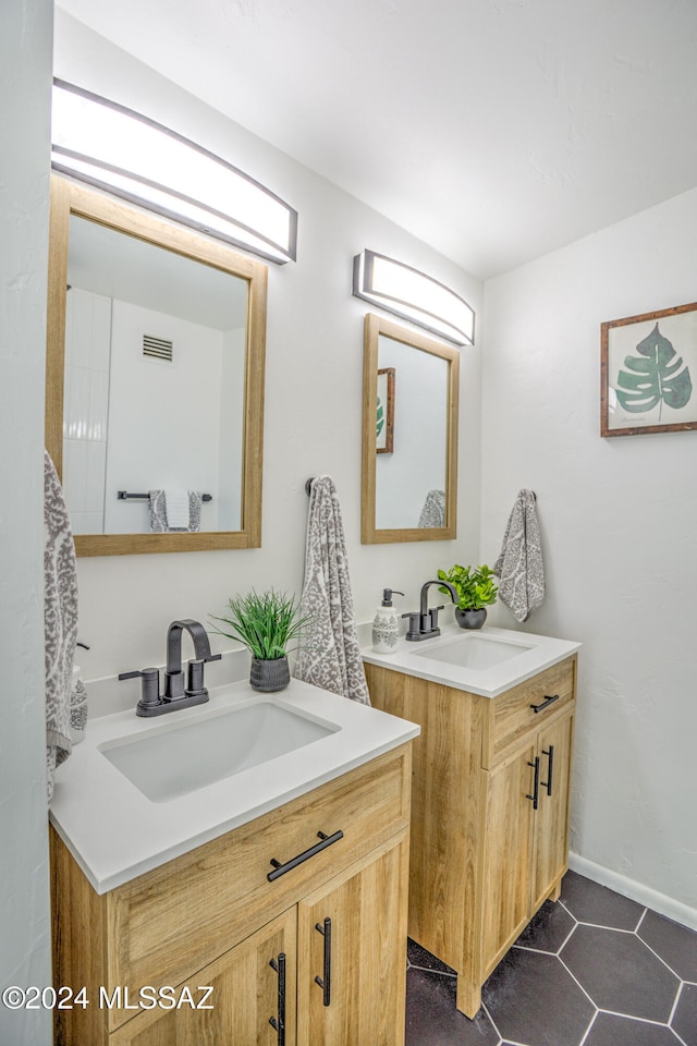 bathroom with vanity and tile patterned floors