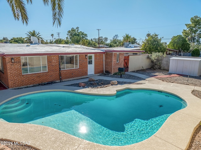 view of swimming pool with a patio