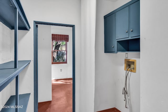 laundry area with cabinets and hookup for a washing machine