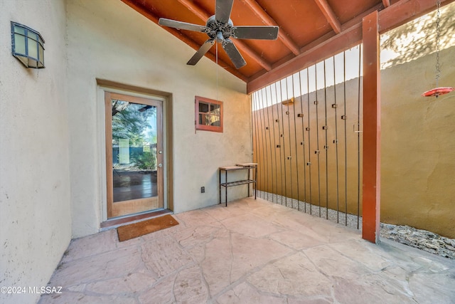 interior space with ceiling fan