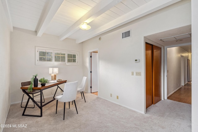 office area with beamed ceiling and light colored carpet