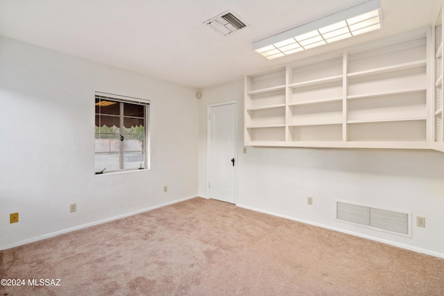 unfurnished room with carpet floors