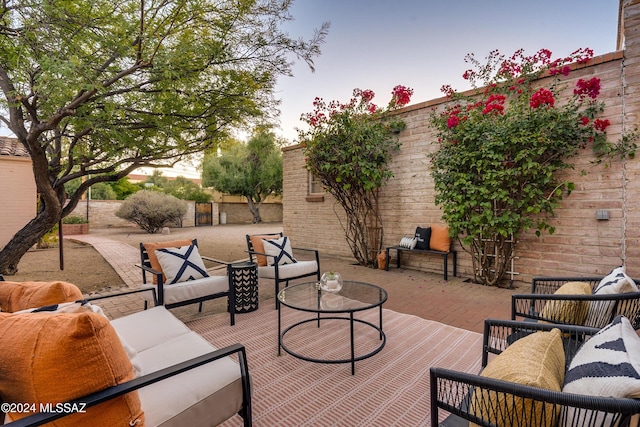 patio terrace at dusk with an outdoor hangout area