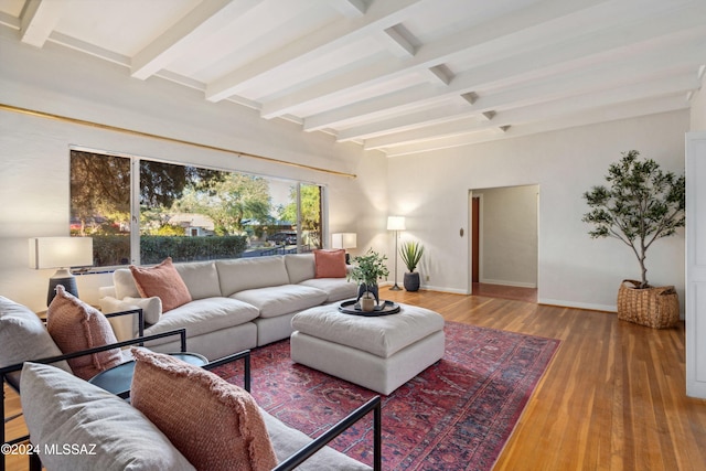 living room with beam ceiling and hardwood / wood-style flooring