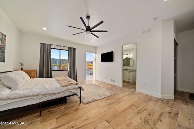 bedroom with recessed lighting, visible vents, ensuite bath, light wood-type flooring, and baseboards