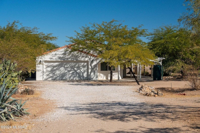 obstructed view of property featuring a garage