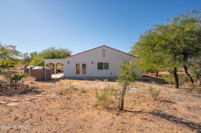 rear view of property featuring french doors