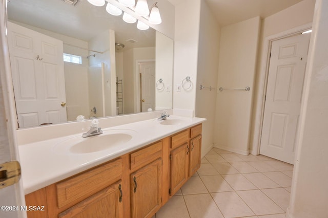 bathroom with vanity and tile patterned flooring