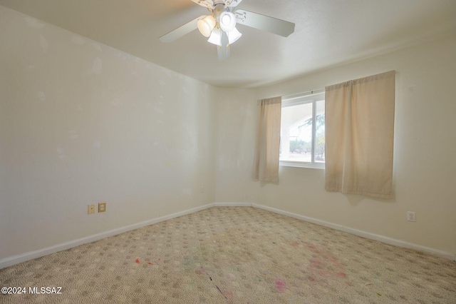 spare room with carpet flooring and ceiling fan