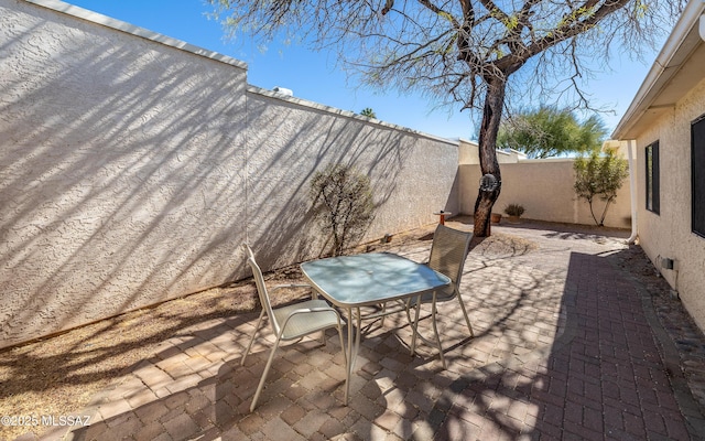 view of patio / terrace featuring outdoor dining space and a fenced backyard