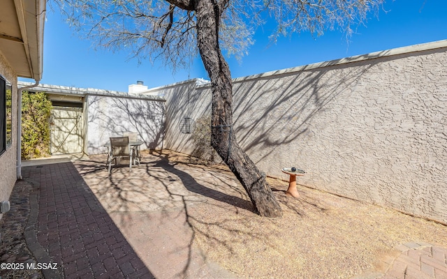 view of patio with fence