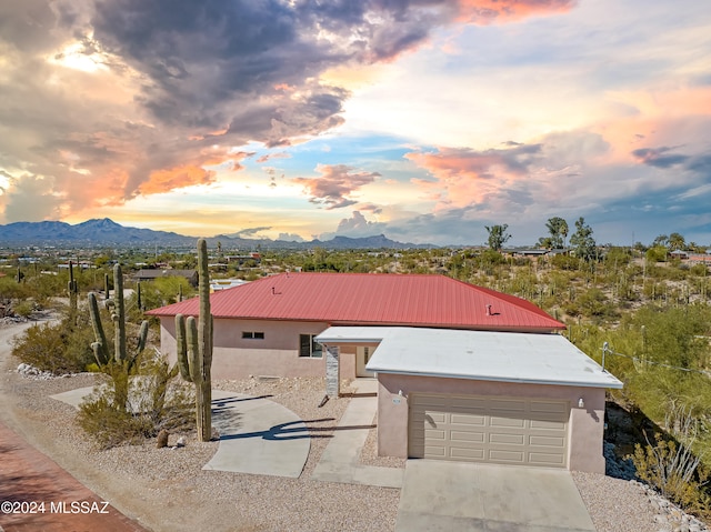 view of front of house featuring a mountain view and a garage