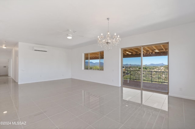 tiled spare room featuring ceiling fan with notable chandelier, plenty of natural light, and an AC wall unit