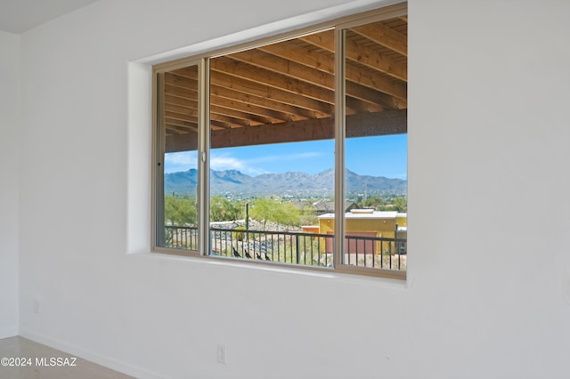 view of patio with a balcony and a mountain view