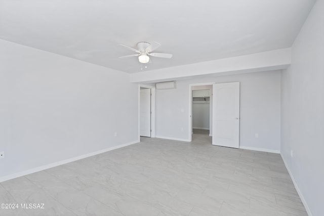 unfurnished room with ceiling fan