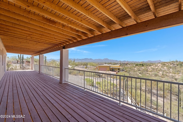 wooden deck featuring a mountain view