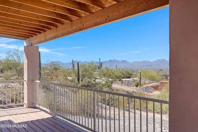 wooden deck with a mountain view