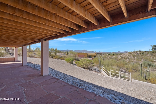 view of patio / terrace featuring a mountain view