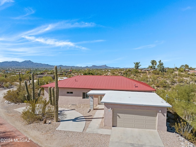 view of front of house with a mountain view and a garage