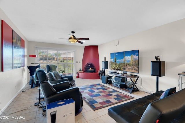 living room featuring ceiling fan and light tile patterned floors