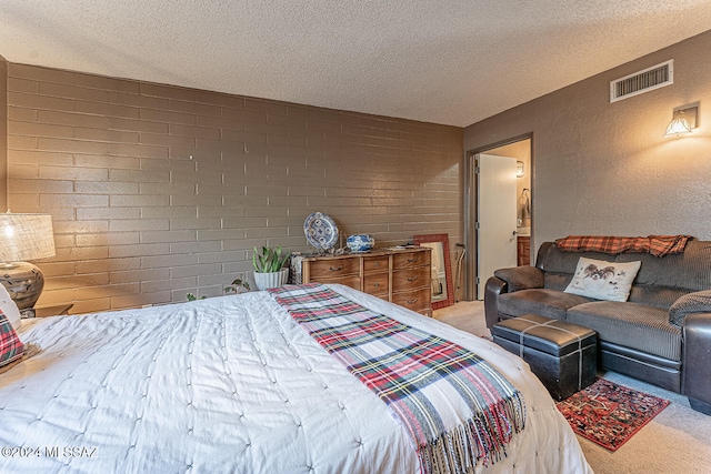 carpeted bedroom with a textured ceiling