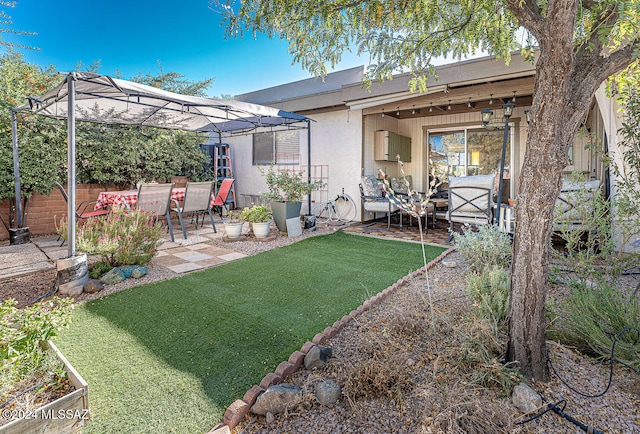 back of property with a patio area and a lawn