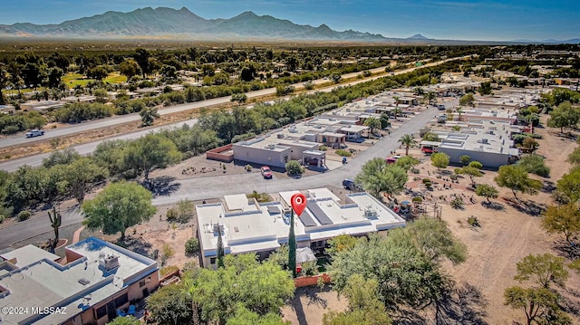 birds eye view of property featuring a mountain view