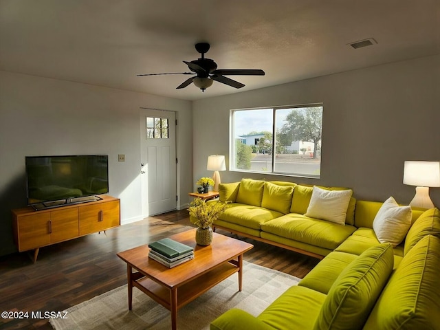 living room featuring wood-type flooring and ceiling fan